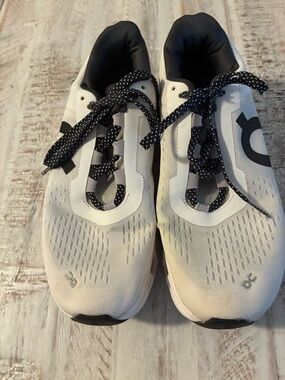 On Cloudmonster running shoes in a white and black colorway women’s size 8